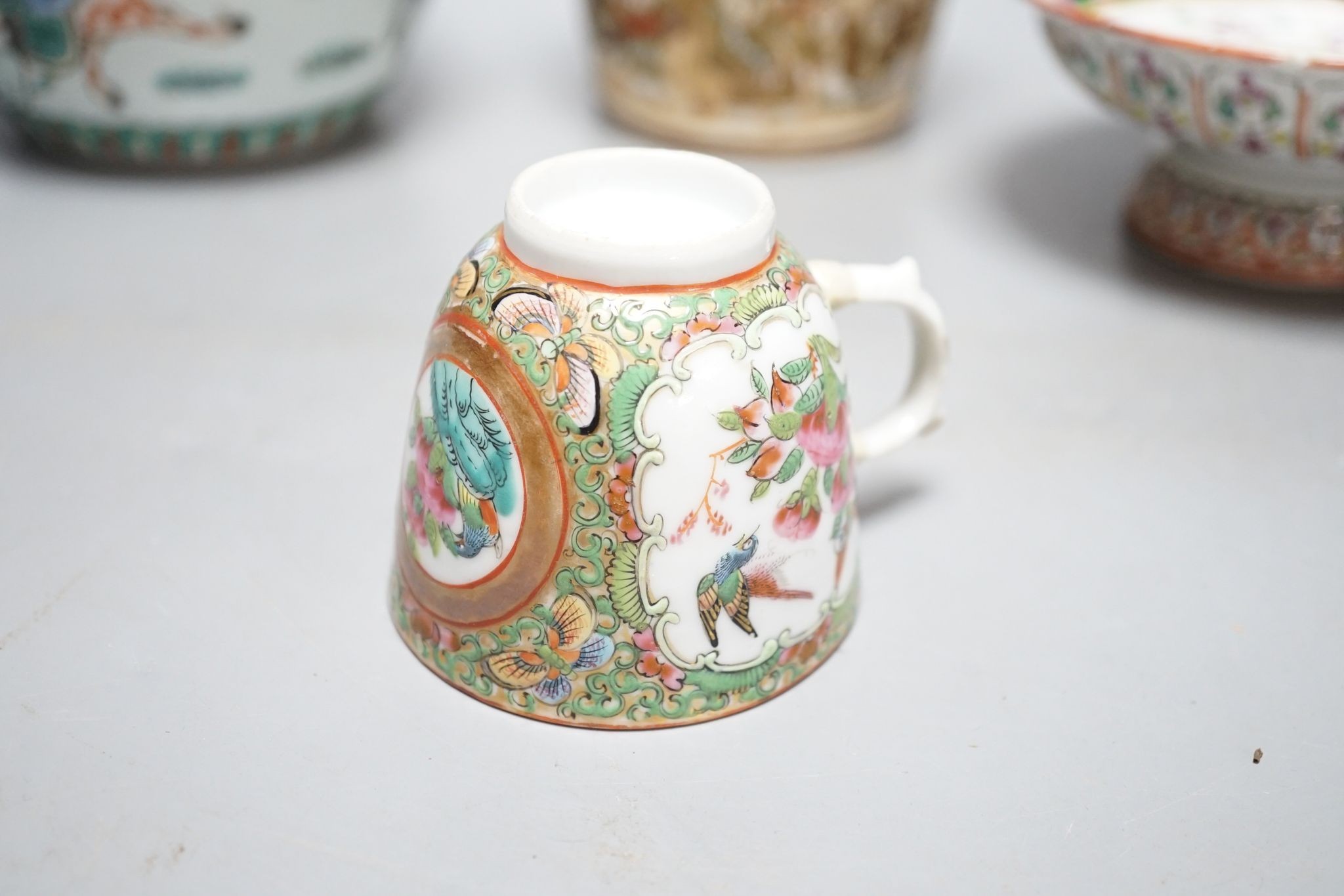 A Chinese famille verte jar, a Chinese enamelled porcelain stem dish, a famille rose cup and a Japanese Satsuma pottery model of a bucket, tallest 15.5cm